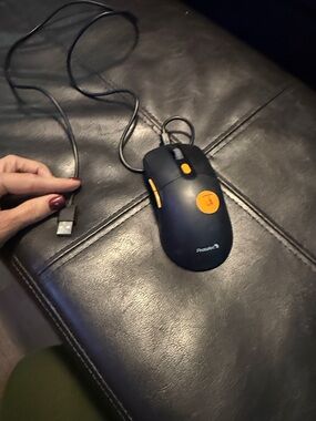 Logitech Black Wired USB Mouse with Orange Accents